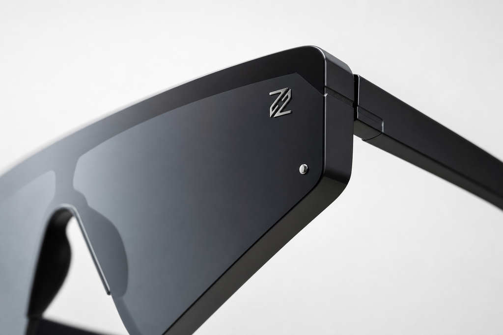DASH sunglasses in black frame with black lenses, macro close-up on hinge and logo detail