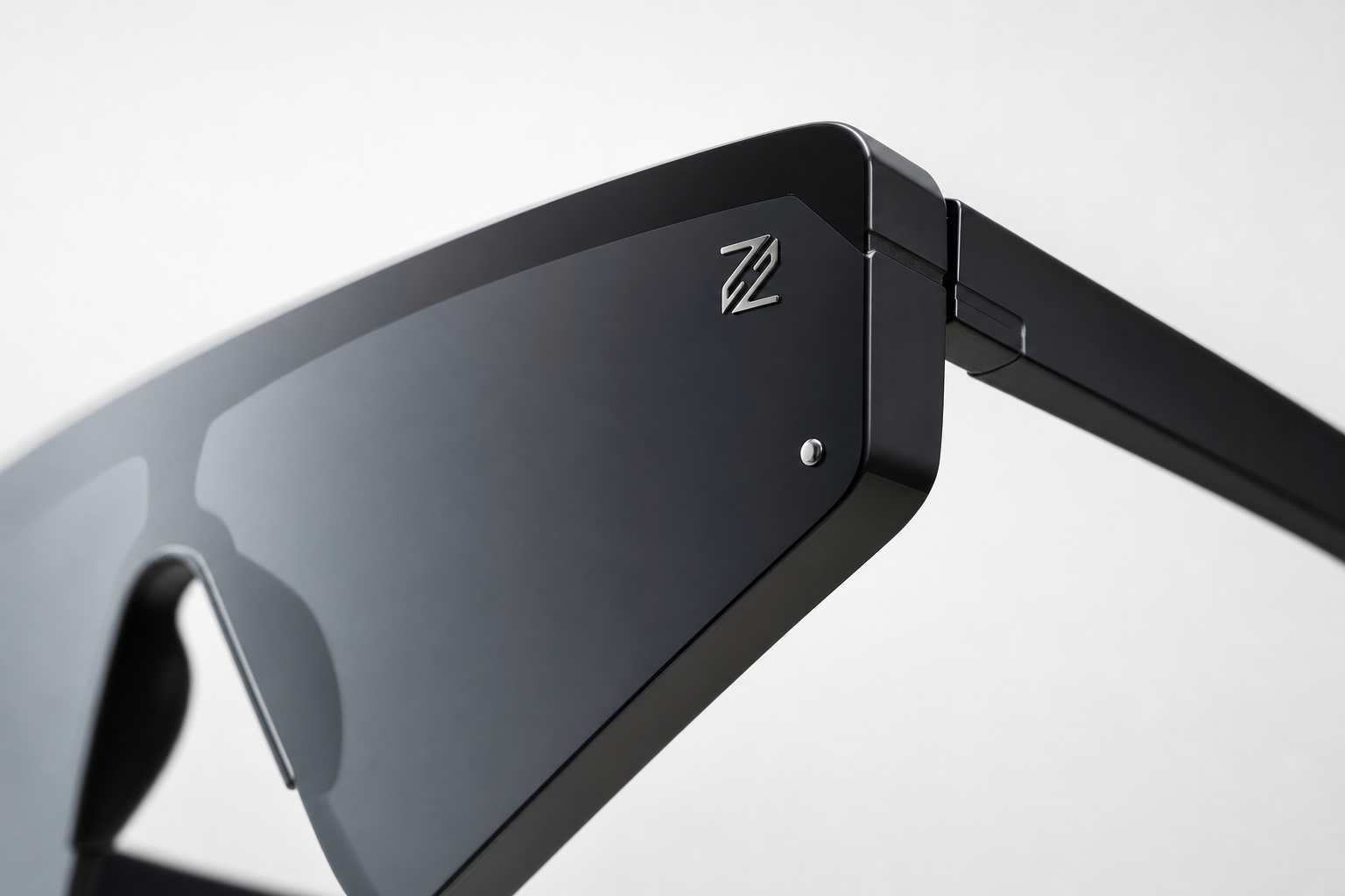 DASH sunglasses in black frame with black lenses, macro close-up on hinge and logo detail