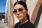 Model wearing HONCHO sunglasses, gold frame with python green accents, LA street style