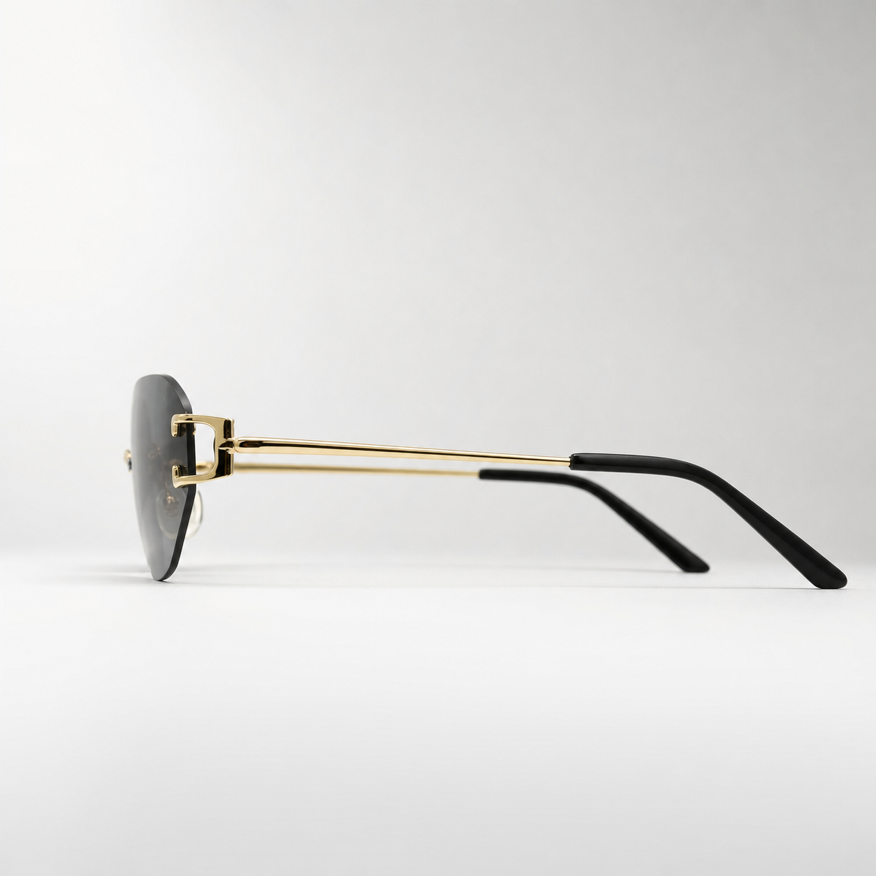 HONCHO sunglasses, gold frame with black accents, side profile view