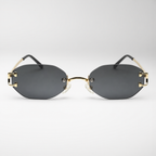HONCHO sunglasses, gold frame with black accents, studio front view