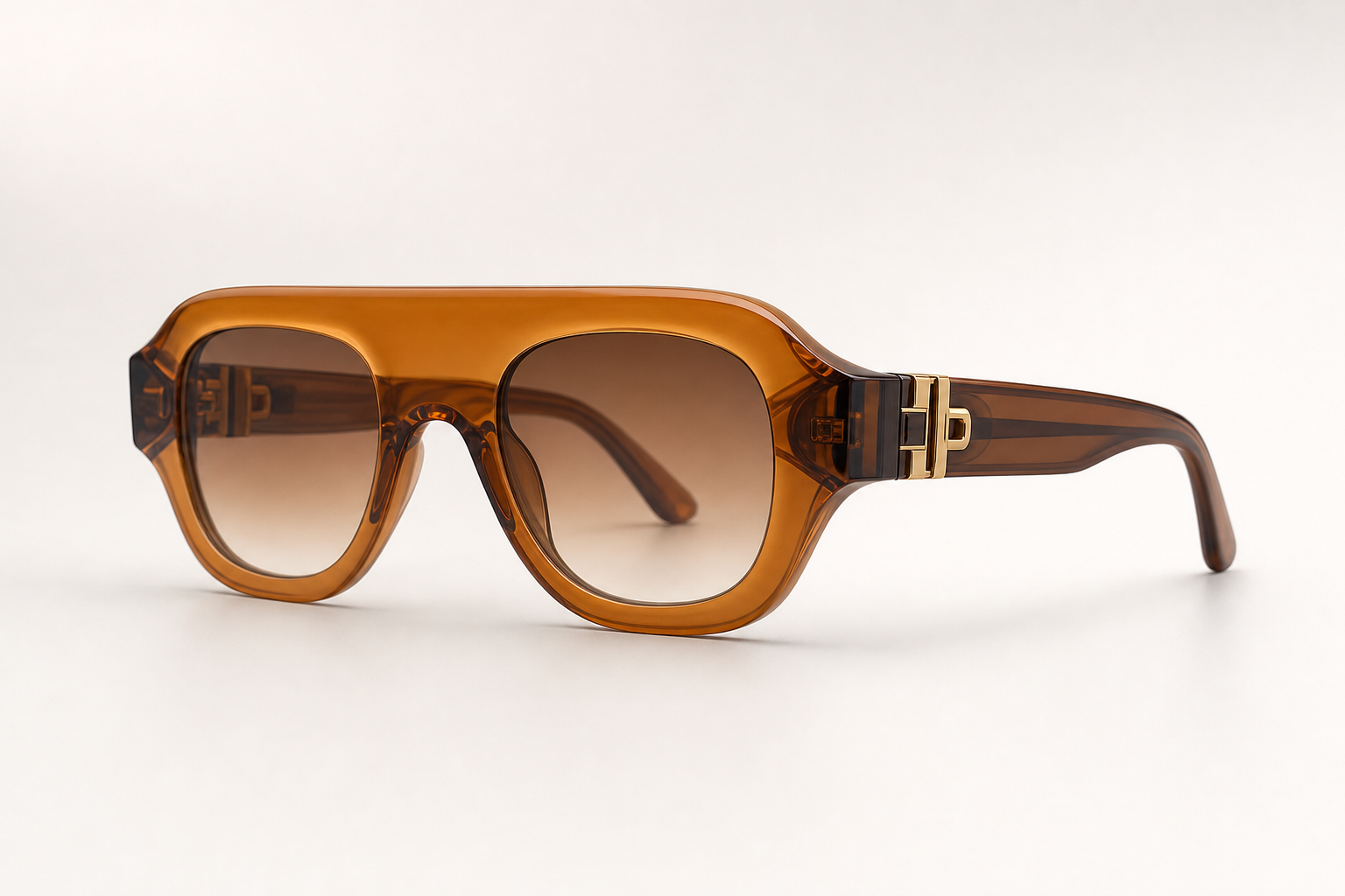 SOLARIS sunglasses in brown frame with gold hardware, 3/4 angled view