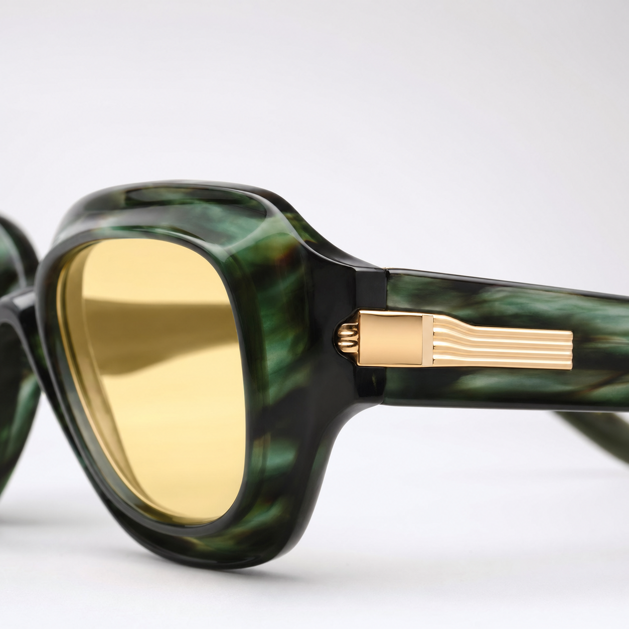SOLARIS sunglasses in green tortoise frame with gold hardware, macro hinge and logo detail