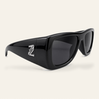 ZAYSHA BLOC sunglasses in Black / Grey, three-quarter angle view