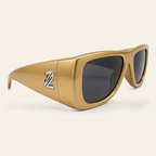 ZAYSHA BLOC sunglasses in Gold / Grey, three-quarter angle view